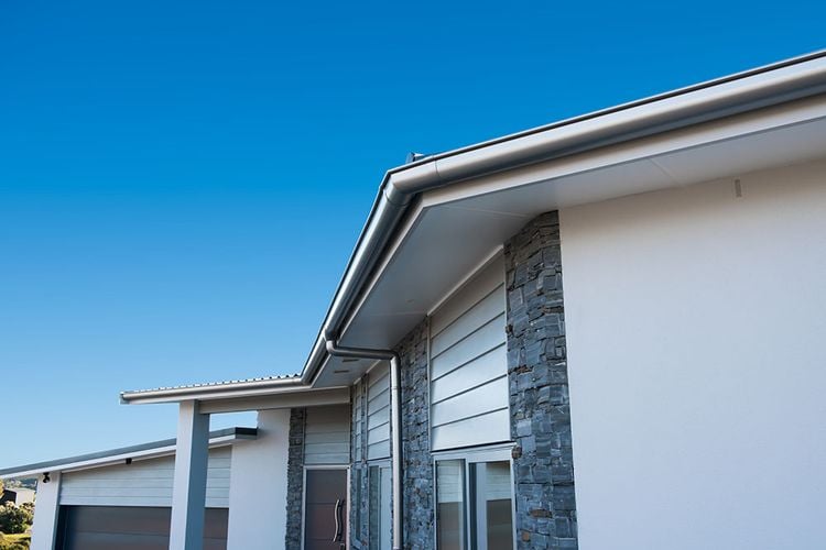 House with shiny metallic drain pipe