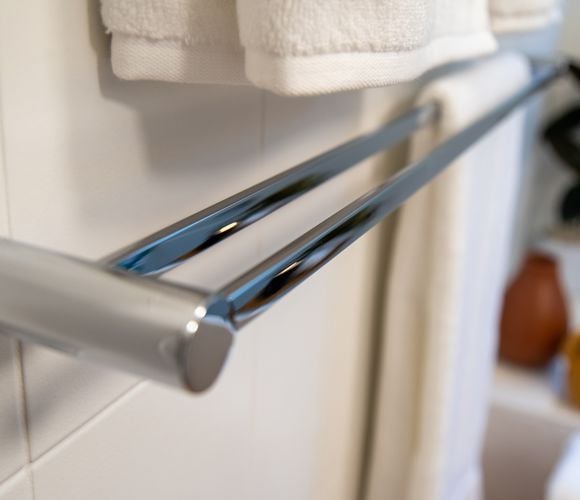 Steel towel rack in bathroom