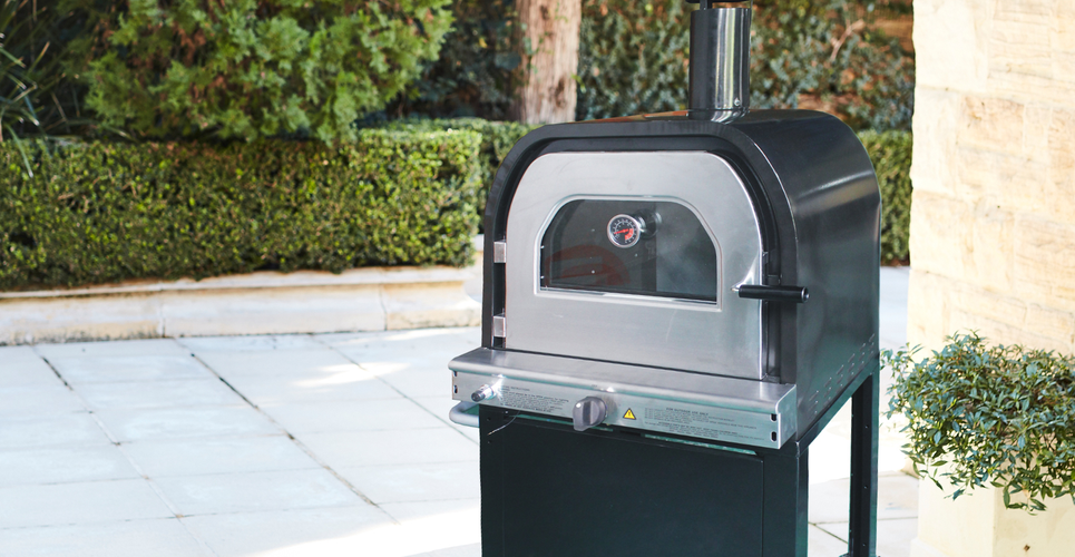 Pizza oven in a tiled backyard