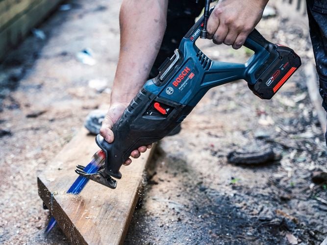 Person cutting timber with the GSA 18V-28 18V BITURBO brushless reciprocating saw.