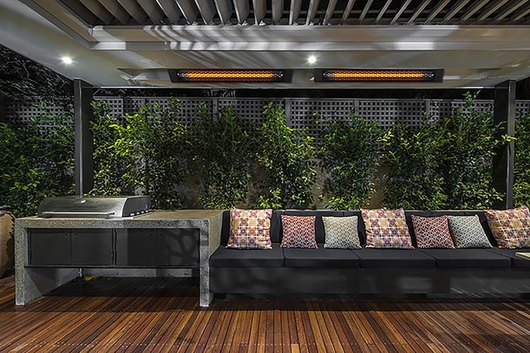 Outdoor lounge area with timber decking and outdoor heaters