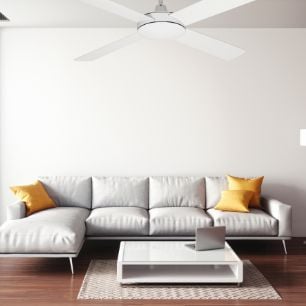 Lounge room with white, L-shaped couch, a white coffee table and white 4-blade ceiling fan