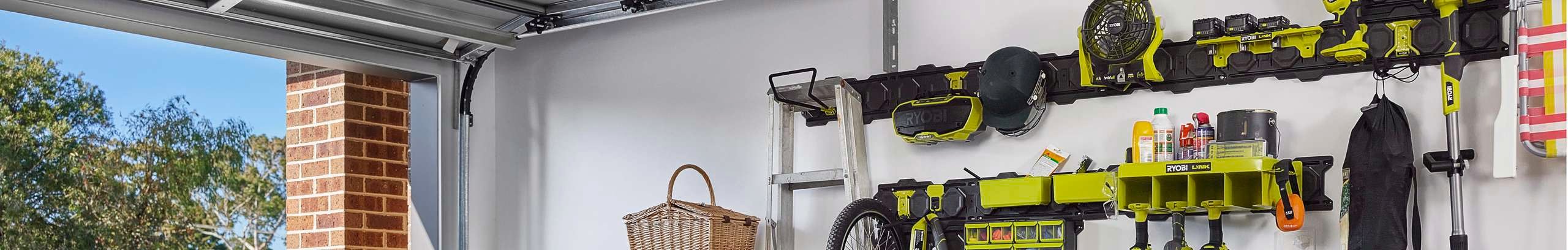 Wall covered in hanging plates and hooks for storing tools.