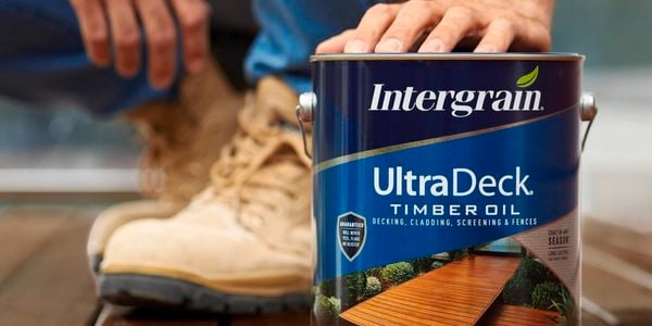Three UltraDeck paint cans.