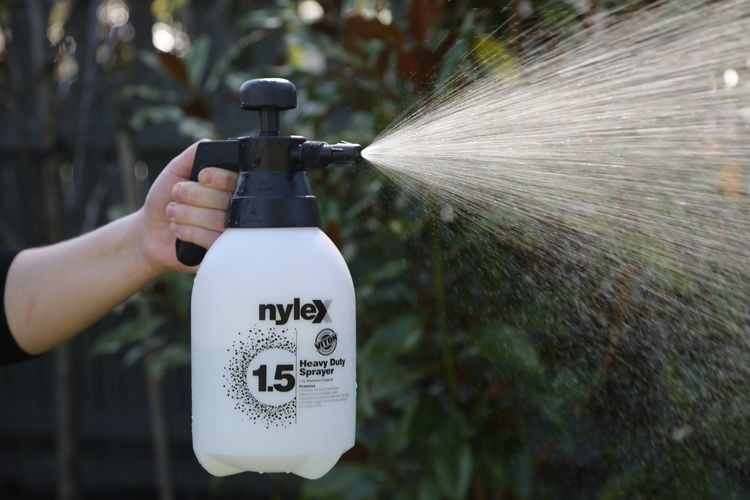 Close up of a Nylex heavy duty water sprayer creating a conical stream of water