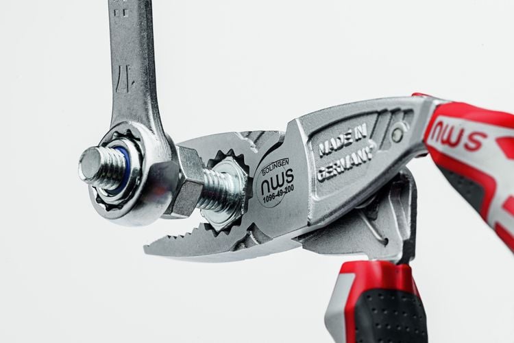 Pliers being used to tighten screw onto bolt