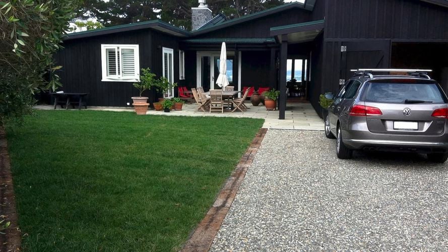 Vehicle grade paving driveway with car parked 