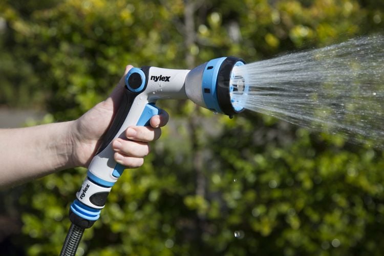 Close up of hand on nylex trigger spray gun 