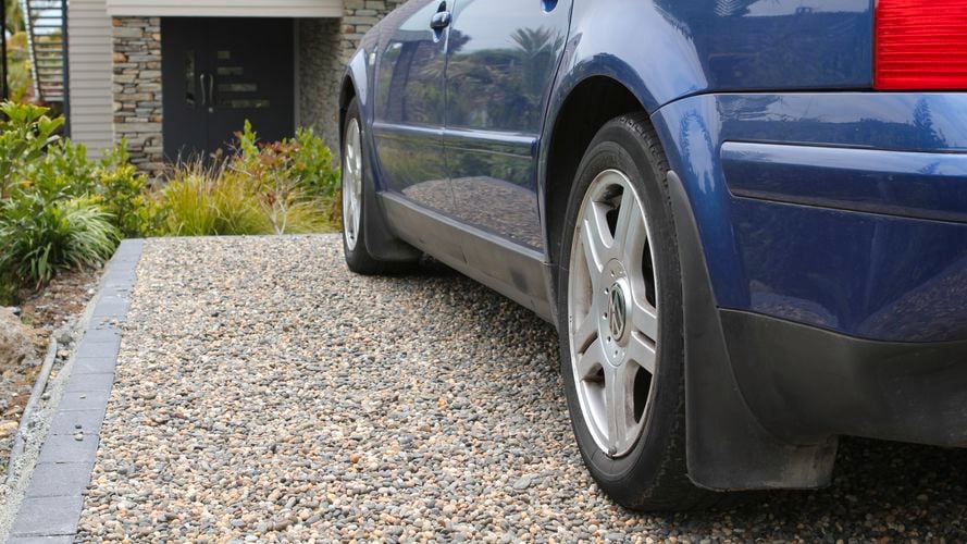 Pebbled parking bay with vehicle grade installed 