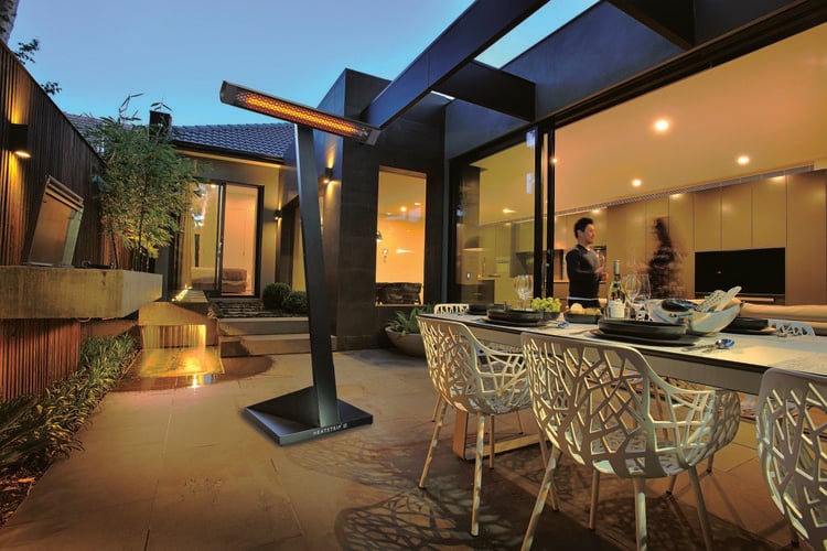 Outdoor area with dining table and outdoor heater