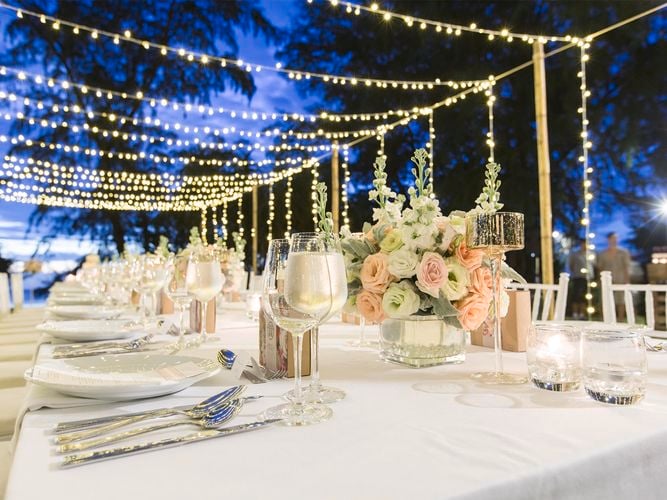 Outdoor dining table with hanging fairy lights