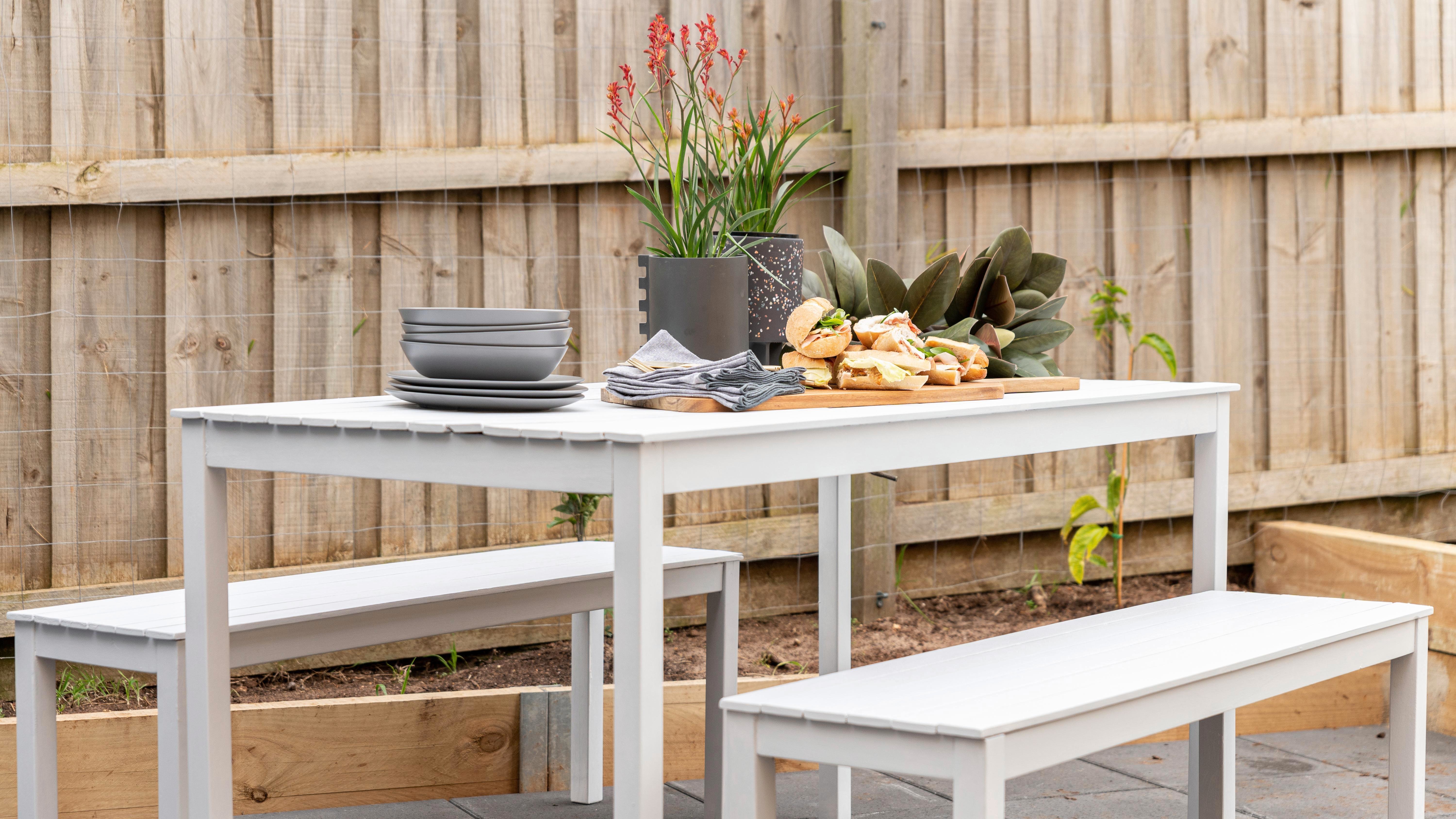 White outdoor dining discount table and chairs