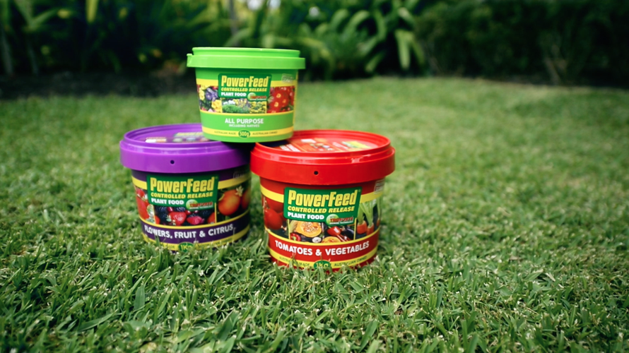Three different buckets of fertiliser stacked on top of each other