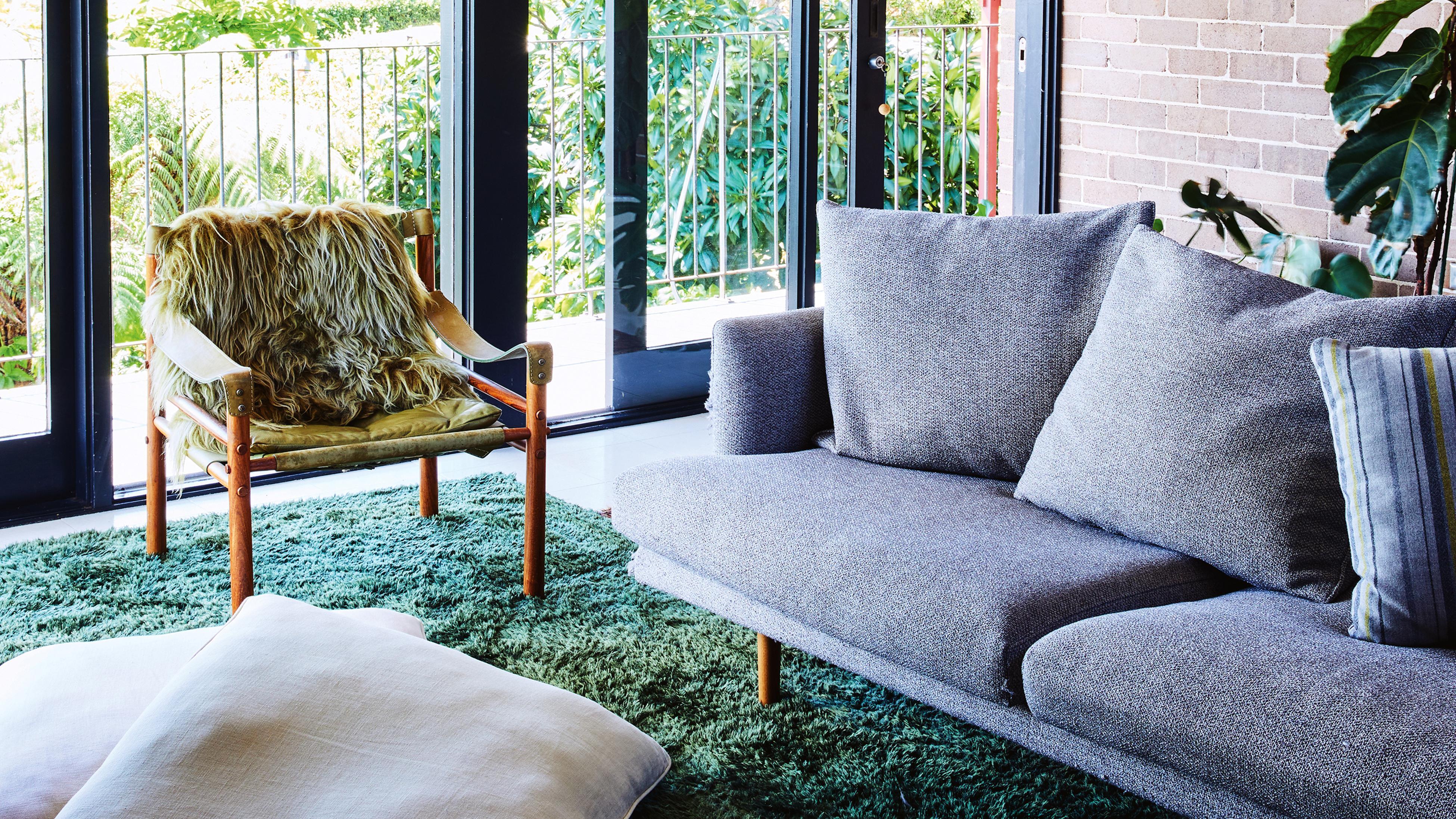 : Lounge room with large sliding timber and glass doors